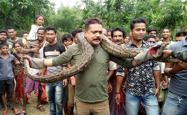 Foreign Media On Bengal Officer Almost Getting Choked By Python