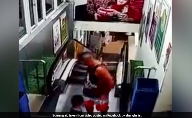 Father, Son Step Off Escalator Just Before It Crashes. Watch Narrow Save