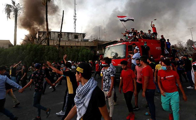 More Than 60 Killed In Clashes As Iraq Protests Turn Violent