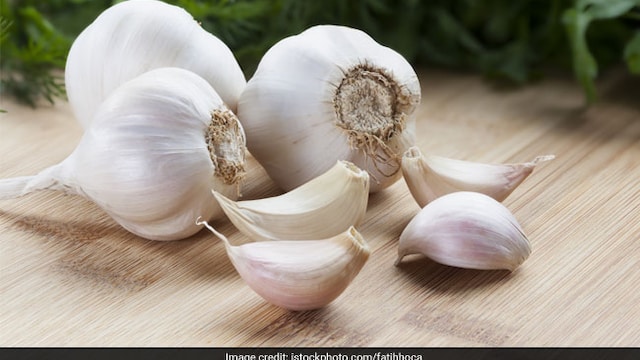 Eating fresh, raw garlic is one among the herbal remedies for controlling high blood pressure.
