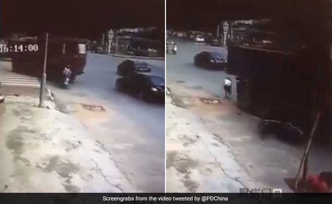 Chinese Woman On 2-Wheeler Run Over By Truck, Then Gets Up And Walks Away