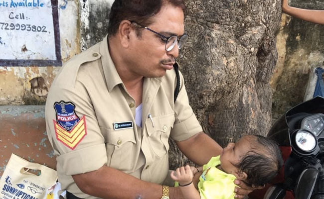 Telangana Cop Babysits While Mother Writes Exam, Wins Hearts