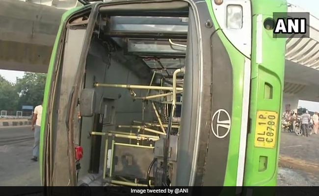 9 Injured As DTC Bus Overturns After Being Hit By Truck