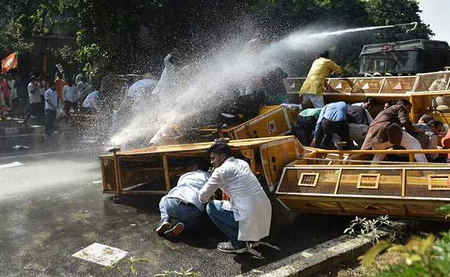 BJP Workers Stage Protests Over Threat To Manoj Tiwari, Wave Black Flags At Arvind Kejriwal