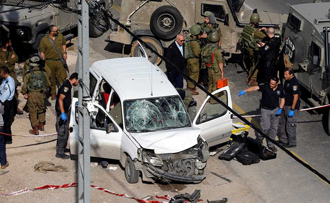 Israeli Policemen Inspect The Scene Of A Car Ramming Attack Near Hebron