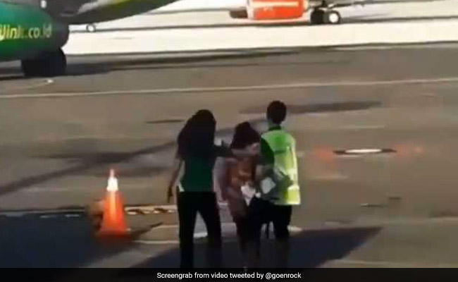 Viral Video Shows Woman Trying To Chase Down Plane After Missing Her Flight