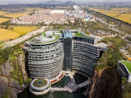 Inside China's Swanky Hotel Built In A Pit, With Suites Below Water Level Inside China's Swanky Hotel Built In A Pit, With Suites Below Water Level