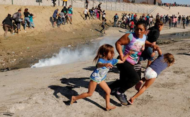 How A Photographer Captured Image Of A Mother, Children Fleeing Tear Gas