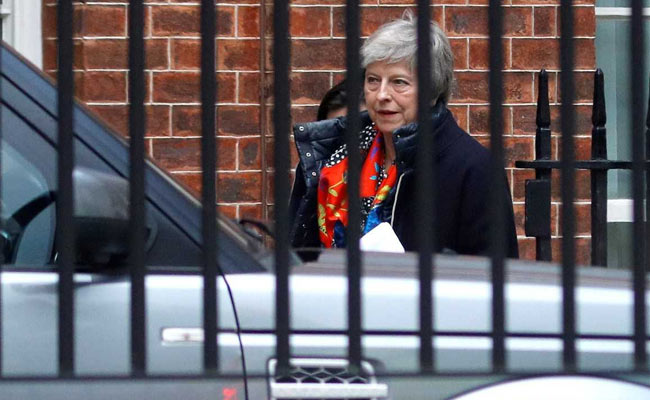 Theresa May Survives, Weakened And With An Exit Date