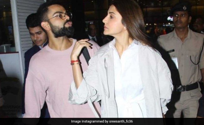 विराट कोहली को देख लग गई फैन्‍स की भीड़, पत्‍नी अनुष्‍का को इस तरह सुरक्षित निकाला एयरपोर्ट से बाहर, देखें VIDEO