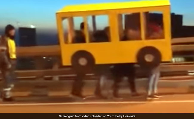 4 Men Dressed Up As A Bus To Cross Vehicle-Only Bridge. Video Will Make You LOL