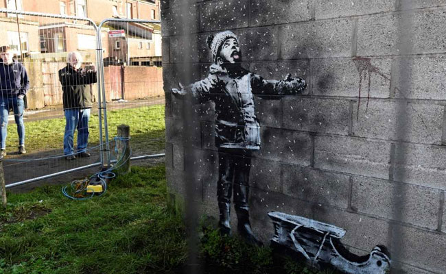 New Banksy Artwork Brings Crowds To Welsh Town