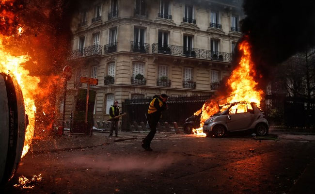 France Scraps Fuel Price Hikes After Weeks Of Protests, Calls For Calm