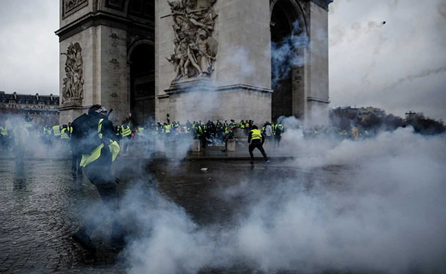 "Yellow Vest" Protests Damage Paris Monuments And Macron's Presidency
