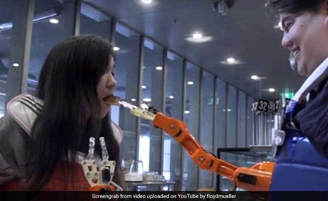 Arm-A-Dine: A Robotic Arm That Feeds You Food, But Only If You Smile