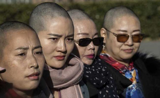 "Want Answers": Wife Of Detained China Activist Goes Bald For Justice