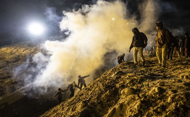 Tear Gas, Pepper Spray Fired As Migrants Try To Illegally Cross US Border