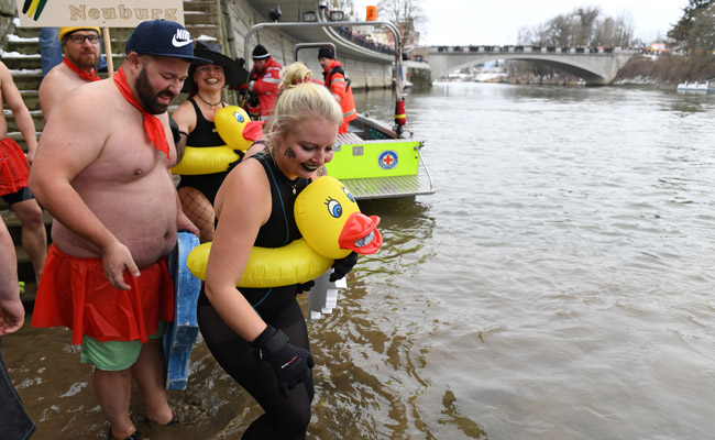 In Icy River Just Above Freezing Point, "Naked Swimmers" Test Their Nerve