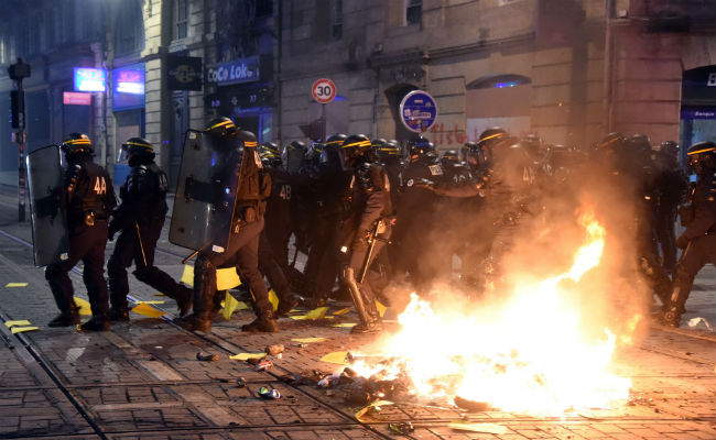 Thousands Of "Yellow Vests" Back On France's Streets To Challenge Macron