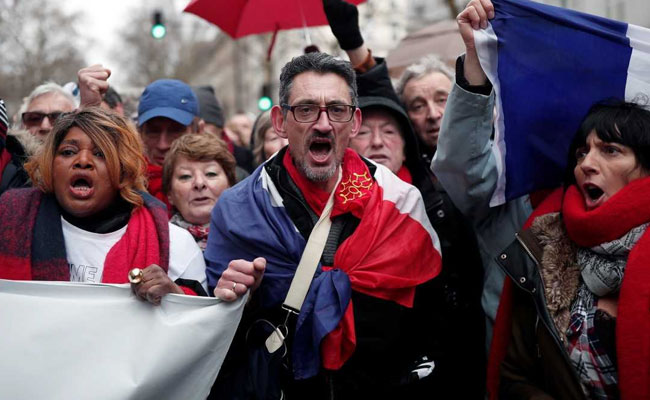 "Red Scarves" Protesters March In Paris Against "Yellow Vest" Violence