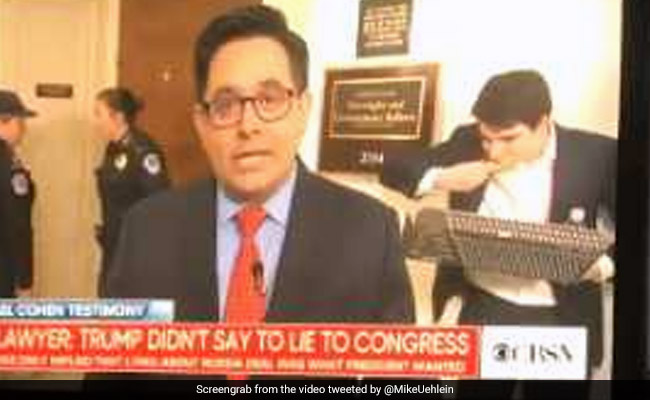 Pizza-Eating Man Photobombs Reporter On Air In Hilarious Video