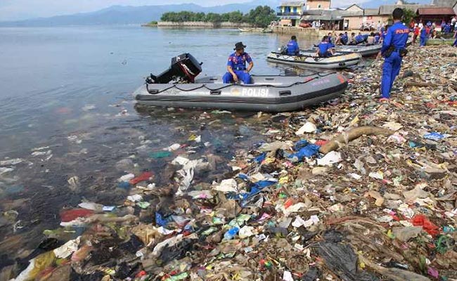 Indonesians Clean Up The Beach One Sandal At A Time