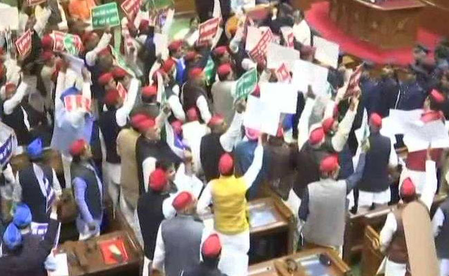SP And BSP Lawmakers Throw Paper Balls, Climb On Tables In UP Assembly
