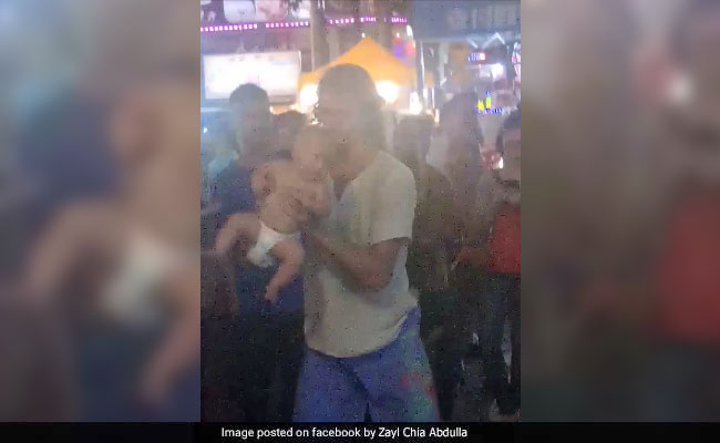 Couple Seen Violently Swinging Their Baby To 'Fund World Tour' Detained
