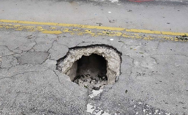 Sinkhole Turns Out To Be Secret Tunnel Leading To Bank