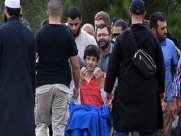 New Zealand Shooting Survivor, 13, Mourns As Father, Brother Are Buried New Zealand Shooting Survivor, 13, Mourns As Father, Brother Are Buried