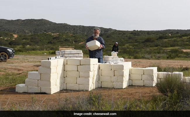 "Make America Grate Again": Artist Builds Cheese Wall On US-Mexico Border