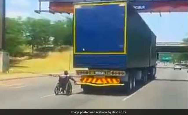 Viral: Man In Wheelchair Speeds Down Busy Road By Holding Onto Truck
