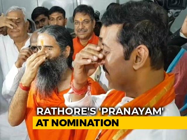 Rajyavardhan Rathore Does <i>Pranayam</i> Before Nomination, Ramdev By His Side