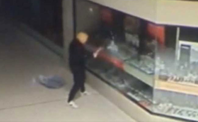 Caught On Camera: Man Wearing Donald Trump Mask Robs Shops
