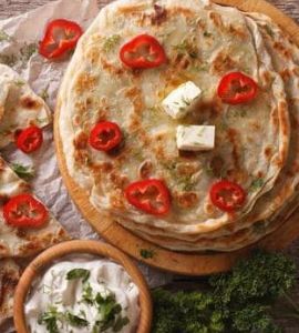 Watch: This Delish Pizza Paratha Stuffed With Cheese And Veggies Is A Fusion Of Our Favourite Flavours Watch: This Delish Pizza Paratha Stuffed With Cheese And Veggies Is A Fusion Of Our Favourite Flavours