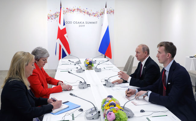 Russia Must End "Irresponsible Activity": Theresa May To Vladimir Putin