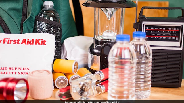 Make an emergency kit with essential food, water, clothing and first aid