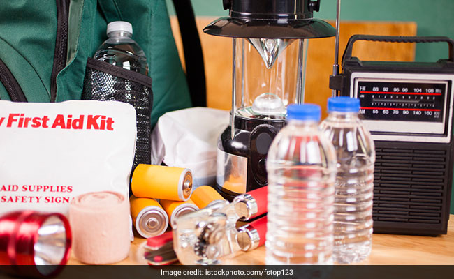 Make an emergency kit with essential food, water, clothing and first aid