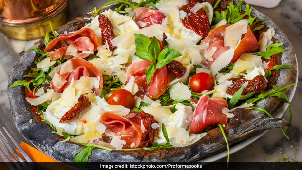 No, This Pizza Isn't Burnt, It's Black Pizza Made With Activated Charcoal!