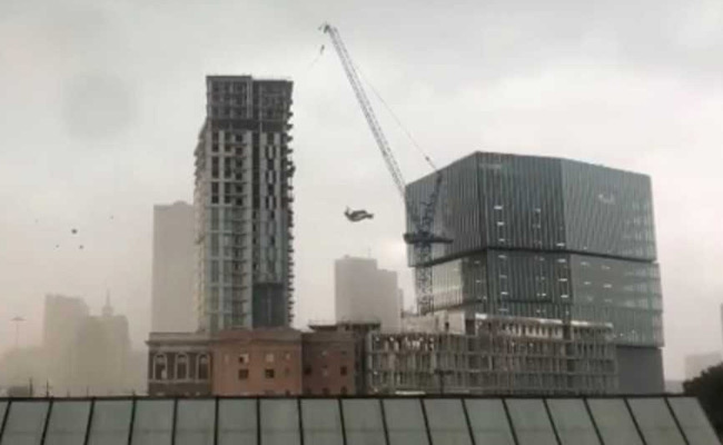 1 Dead, 6 Injured After Crane Collapses On Apartment Building In US