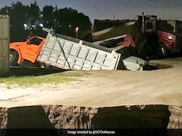 Massive Holes Open Up Suddenly On Road, Swallow Several Trucks. See Pics Massive Holes Open Up Suddenly On Road, Swallow Several Trucks. See Pics