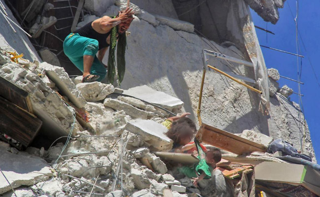 From Syria, A Haunting Photo Of Children Trying To Save Baby Sister