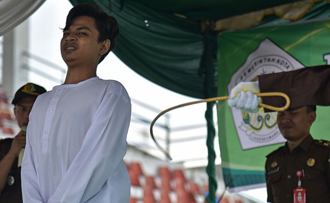2 Men, Woman Whipped 100 Times Each In Indonesia For Breaking Sharia Law