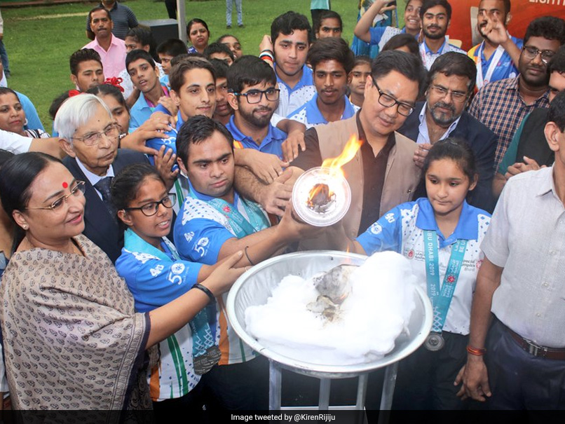 Sports Minister Receives Special Olympic Torch