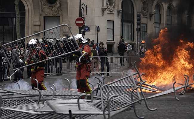 Cops, Protesters Clash In Paris During France's National Day Celebration