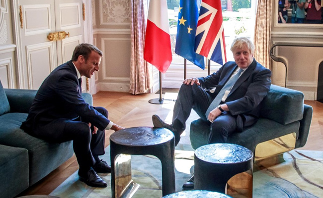 UK's Boris Johnson Puts His Feet Up In French President Macron's Palace