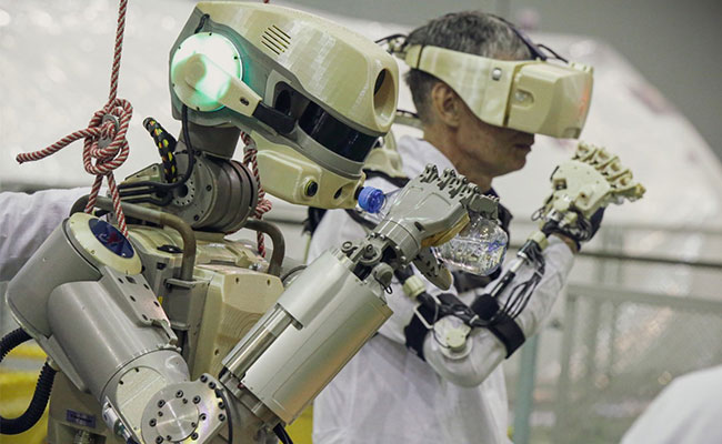 Soyuz Spacecraft Carrying Humanoid Robot Docks At Space Station