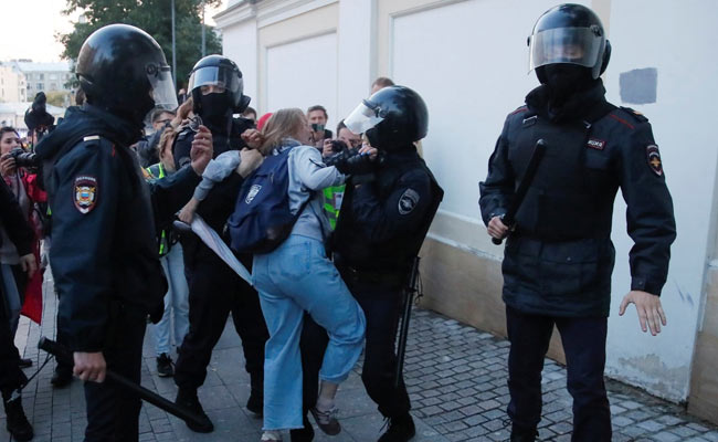 Russian Police Probe Video Of Officer Punching, Dragging Woman