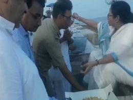 On Camera, IPS Officer Touches Mamata Banerjee's Feet After She Feeds Cake On Camera, IPS Officer Touches Mamata Banerjee's Feet After She Feeds Cake