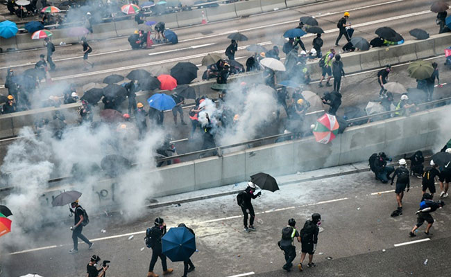 Police Fire Water Cannon, Tear Gas At Hong Kong Protesters
